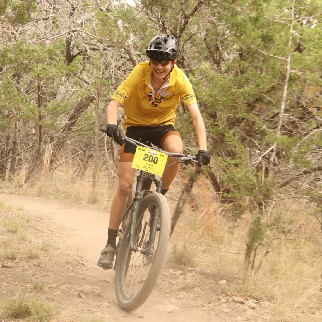 A Stingers rider racing on a cross-country course