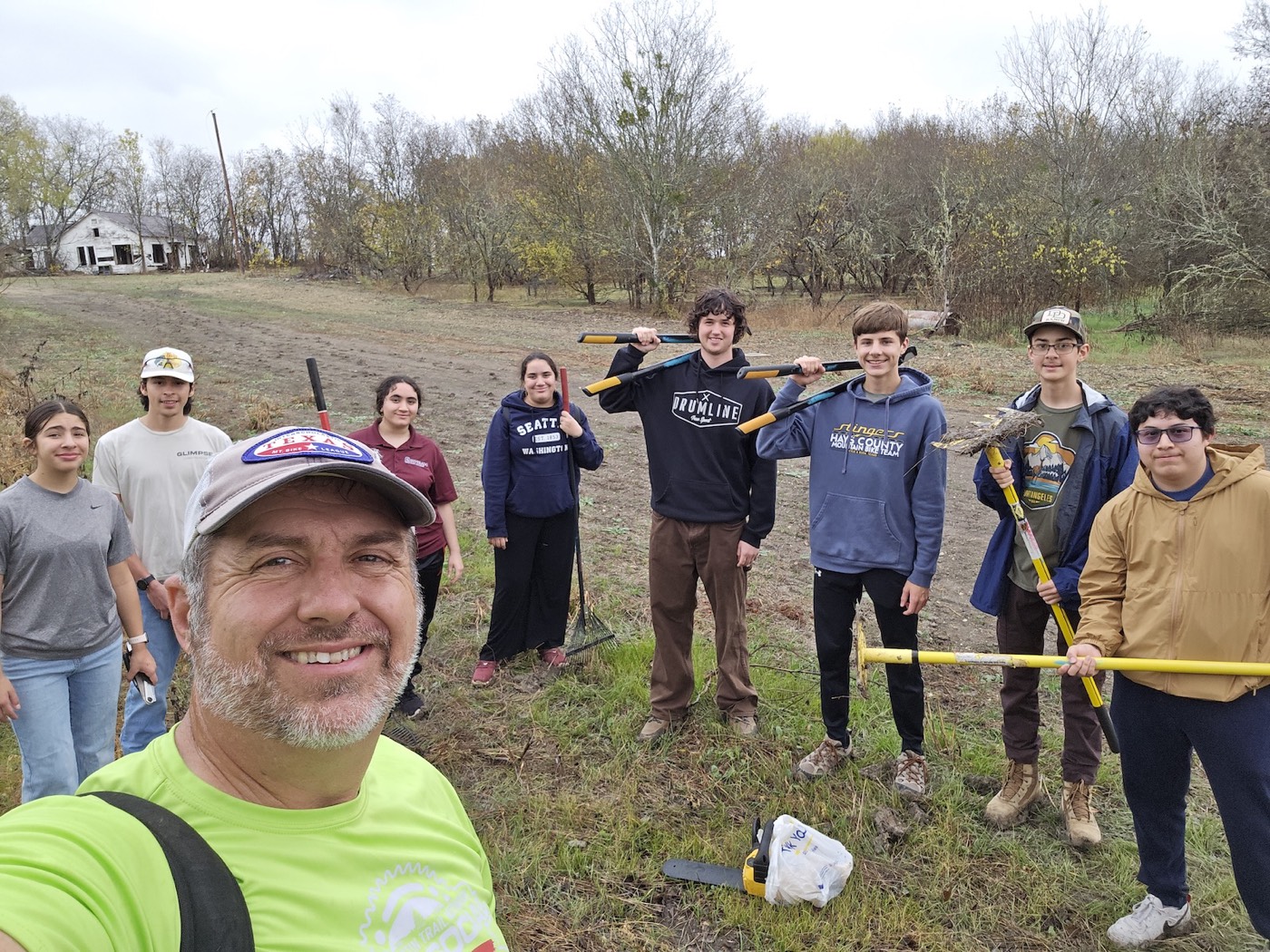 Stingers students volunteering at a team trail-work day